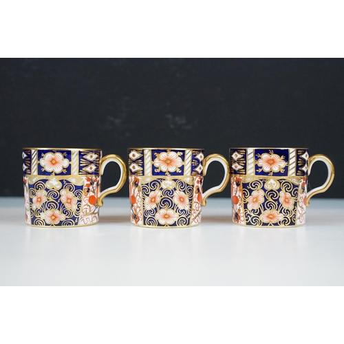 68 - Set of four Royal Crown Derby demitasse coffee cups and saucers in the traditional Imari pattern, 24... 