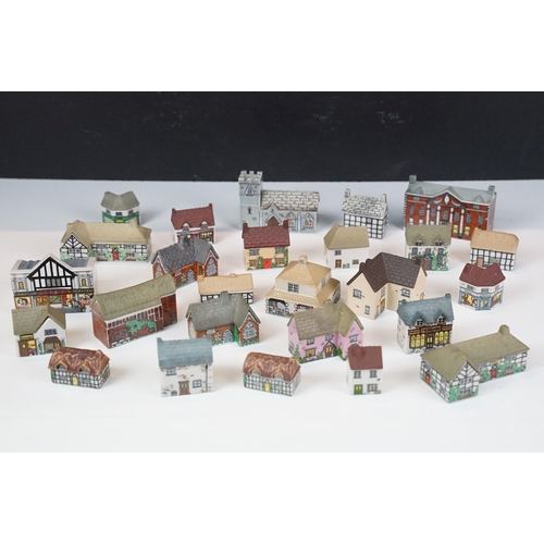 70 - Quantity of Wade Whimsey-on-Why miniature ceramic houses, to include Bloodshot Hall, Picture Palace,... 