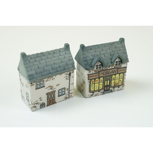 70 - Quantity of Wade Whimsey-on-Why miniature ceramic houses, to include Bloodshot Hall, Picture Palace,... 