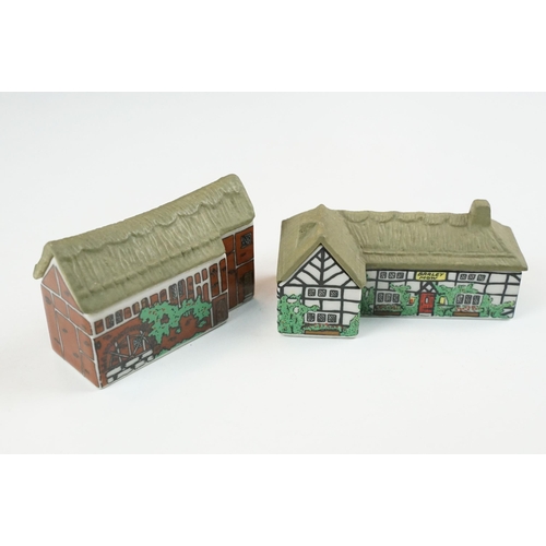 70 - Quantity of Wade Whimsey-on-Why miniature ceramic houses, to include Bloodshot Hall, Picture Palace,... 