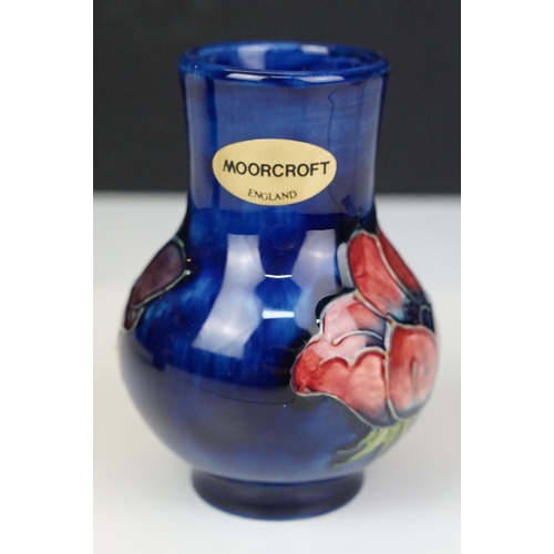 73 - Moorcroft pottery 'Anemone' small baluster vase, H 10.5cm and taller vase, H 13cm with sticker and s... 