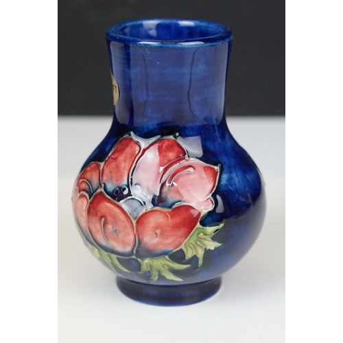 73 - Moorcroft pottery 'Anemone' small baluster vase, H 10.5cm and taller vase, H 13cm with sticker and s... 