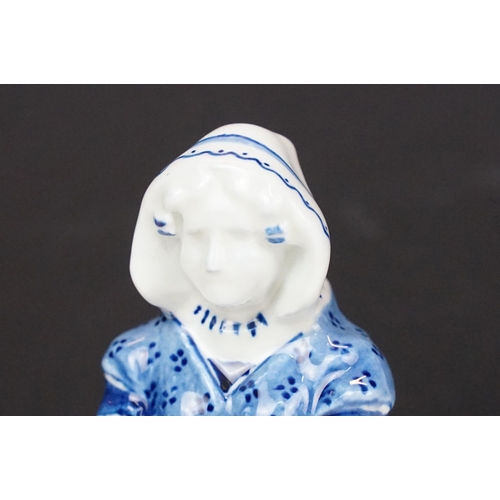 74 - Focke and Meltzer Delft ware lady with basket figurine 'De Porceleyne Fles', H 16cm