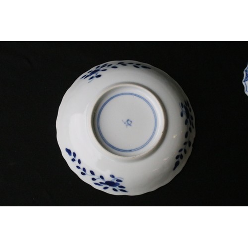 204A - Two Chinese blue and white pieces to include a round dish hand painted with florals and mountain sce... 