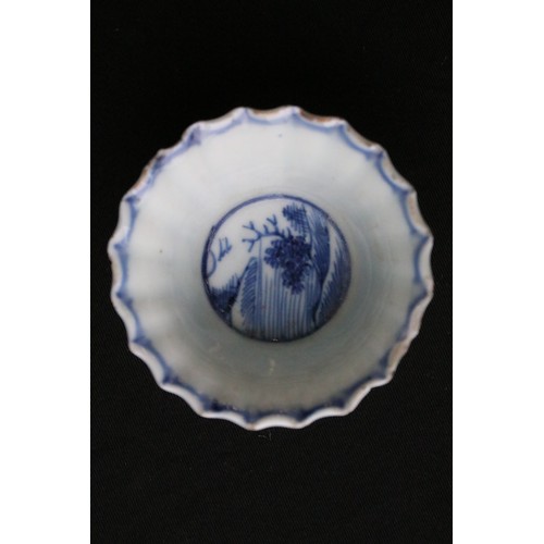 204A - Two Chinese blue and white pieces to include a round dish hand painted with florals and mountain sce... 