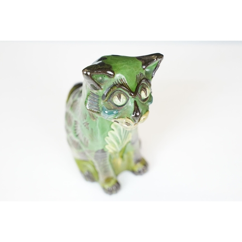 20A - C H Brannam green glazed pottery model of smiling cat, signed to base, H 17.5cm