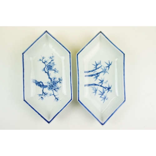 82 - Pair of small blue and white dishes with cherry blossom and bamboo decoration and blue border togeth... 