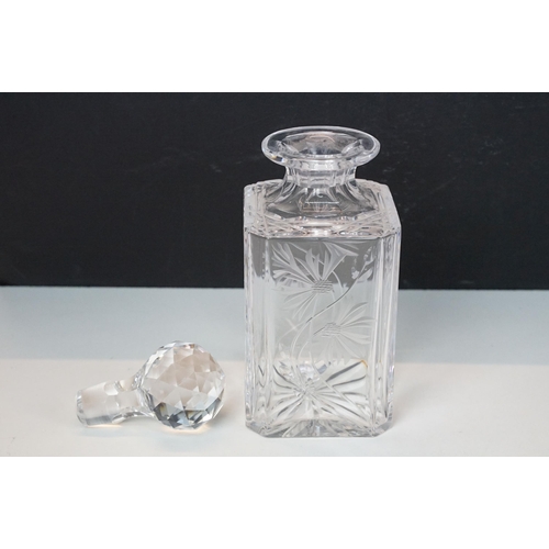 97 - Three glass decanters with etched and diamond cut examples together with an assortment of stoppers i... 