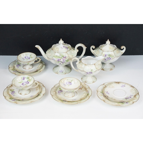 98 - R.S Poland China tea service set with lilac flowers and gilt detail comprising of three cups, four s... 