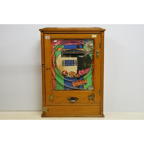 165 - Wonder's 'Quick Returns' one ball release penny slot machine, coin entry, hinged wooden case, H 89cm... 