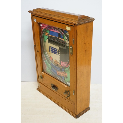 165 - Wonder's 'Quick Returns' one ball release penny slot machine, coin entry, hinged wooden case, H 89cm... 