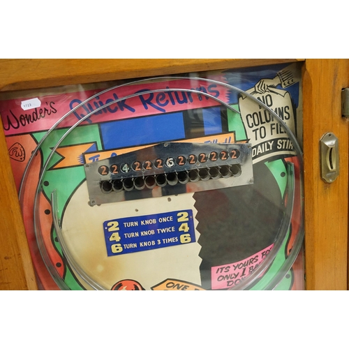 165 - Wonder's 'Quick Returns' one ball release penny slot machine, coin entry, hinged wooden case, H 89cm... 