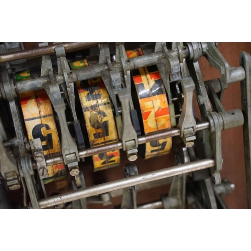 166 - Early 20th century Rollofix one armed bandit, penny play machine with three reels, coin entry, hinge... 