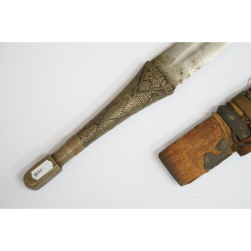 269 - An antique Omani Kattara sword, complete with wooden scabbard.