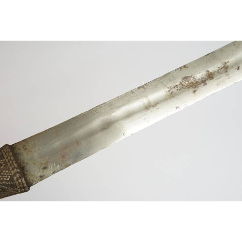 269 - An antique Omani Kattara sword, complete with wooden scabbard.