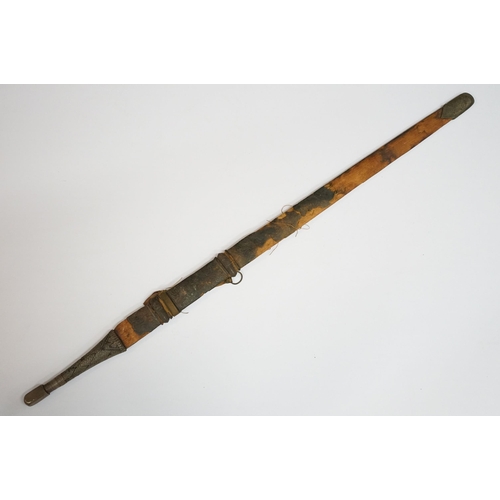 269 - An antique Omani Kattara sword, complete with wooden scabbard.