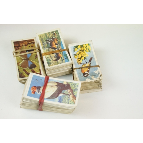 272 - A collection of cigarette and tea cards within albums and together with loose examples to include Br... 