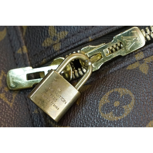 277 - Louis Vuitton Evasion monogram sports bag travel luggage, brass LV hardware, zip top, internal canva... 