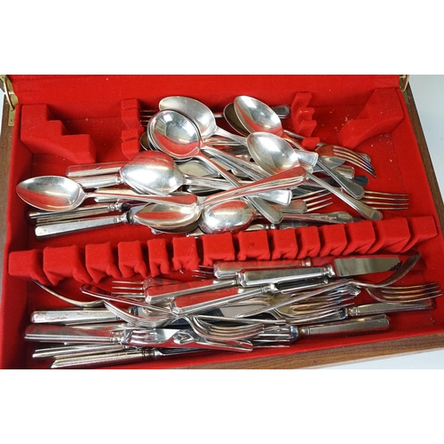 283 - A collection of silver plated cutlery within a wooden fitted cased together with a set of six butter... 