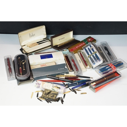 284 - A large collection of vintage pens and propelling pencils to include Parker, Conway Stewart and Wate... 