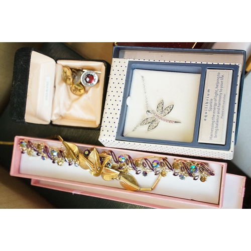 285 - A large collection of vintage and contemporary costume jewellery contained within jewellery boxes an... 