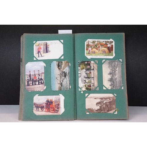 290 - An early 20th century postcard album with contents to include a good selection of real photo and pri... 