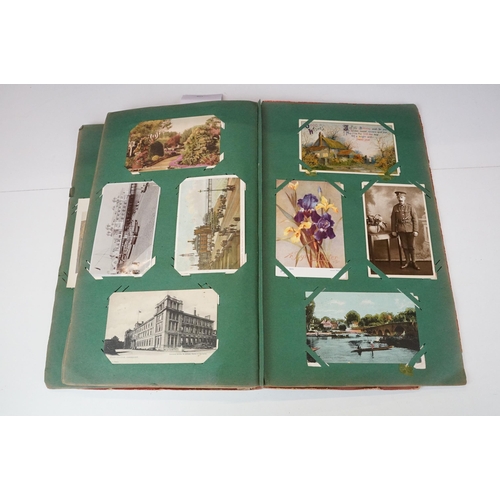 290 - An early 20th century postcard album with contents to include a good selection of real photo and pri... 