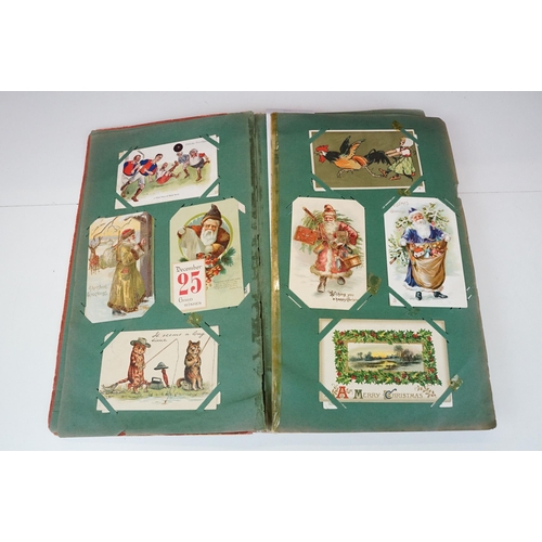 290 - An early 20th century postcard album with contents to include a good selection of real photo and pri... 