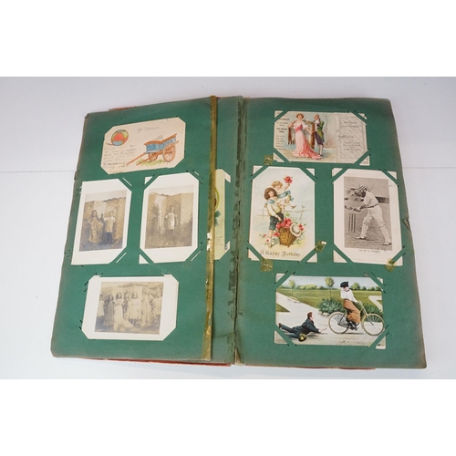 290 - An early 20th century postcard album with contents to include a good selection of real photo and pri... 