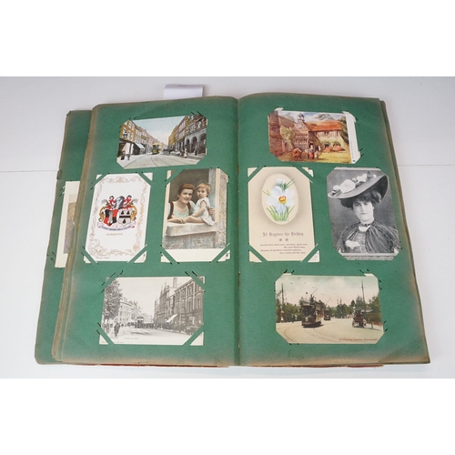 290 - An early 20th century postcard album with contents to include a good selection of real photo and pri... 