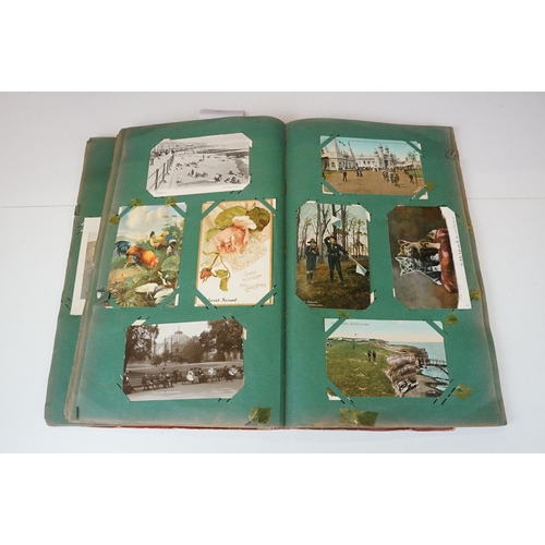 290 - An early 20th century postcard album with contents to include a good selection of real photo and pri... 