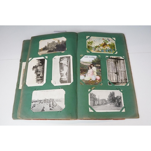 290 - An early 20th century postcard album with contents to include a good selection of real photo and pri... 