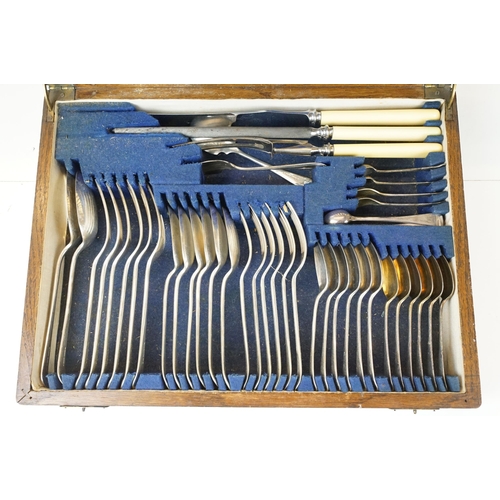 292 - An oak cutlery canteen complete with silver plated cutlery by Viners.