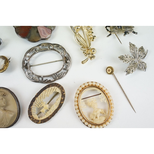 295 - A collection of antique and vintage brooches to include silver examples and a Scottish white metal a... 