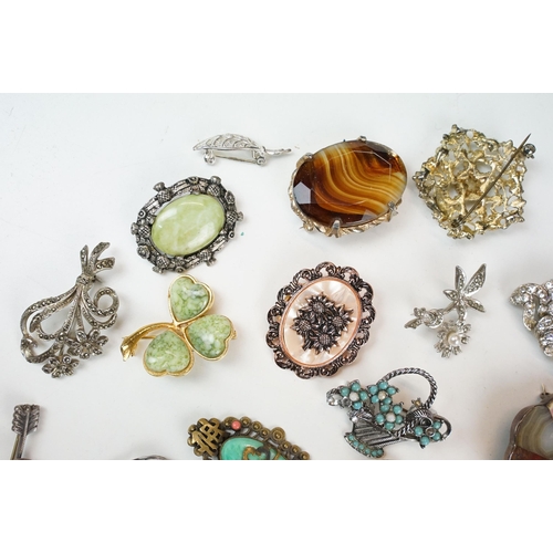 295 - A collection of antique and vintage brooches to include silver examples and a Scottish white metal a... 