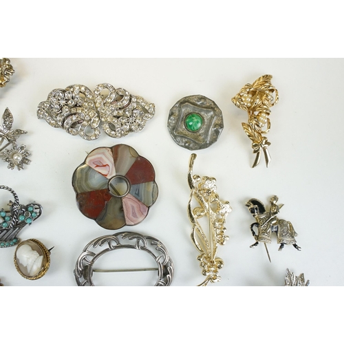 295 - A collection of antique and vintage brooches to include silver examples and a Scottish white metal a... 