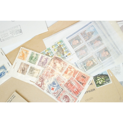 301 - A small collection of British and world stamps to include mint and commemorative examples.