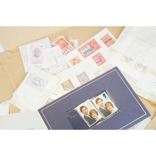 301 - A small collection of British and world stamps to include mint and commemorative examples.