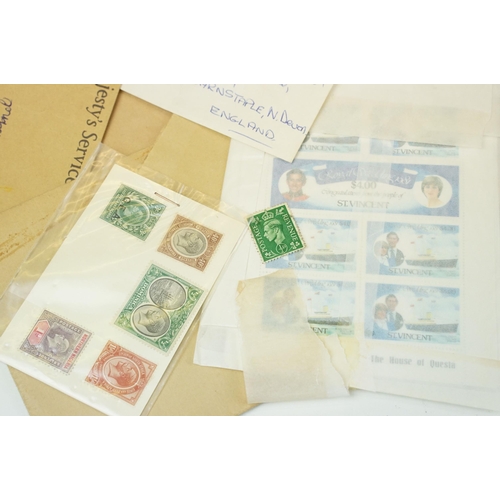 301 - A small collection of British and world stamps to include mint and commemorative examples.