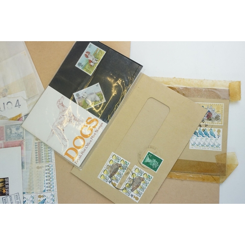 301 - A small collection of British and world stamps to include mint and commemorative examples.