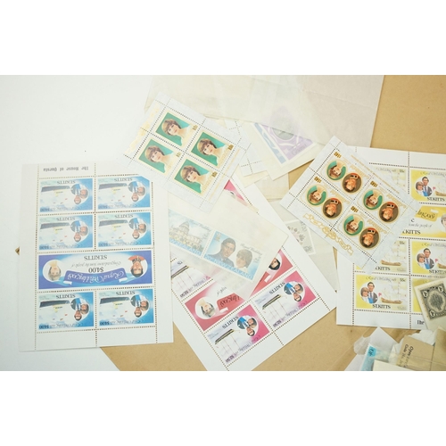 301 - A small collection of British and world stamps to include mint and commemorative examples.