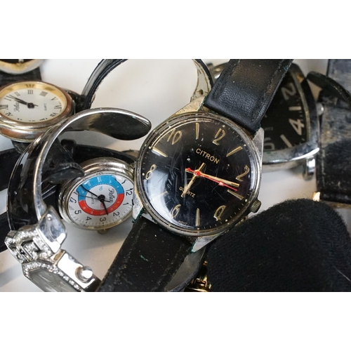 302 - A large collection of mixed wristwatches contained within a large porcelain bowl.