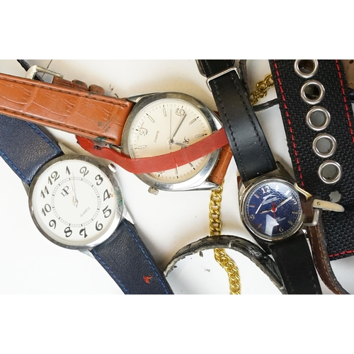 302 - A large collection of mixed wristwatches contained within a large porcelain bowl.