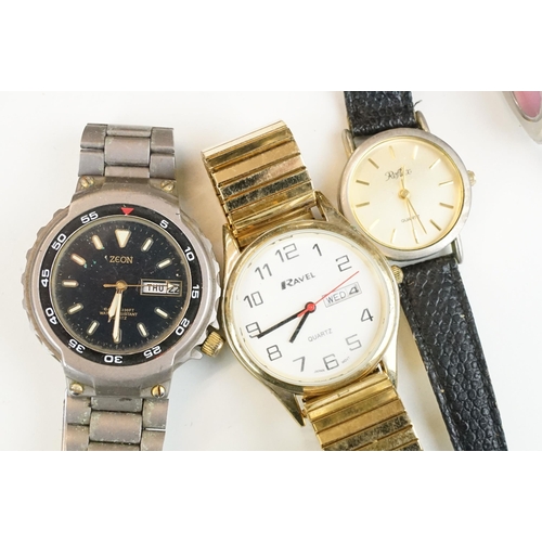 302 - A large collection of mixed wristwatches contained within a large porcelain bowl.