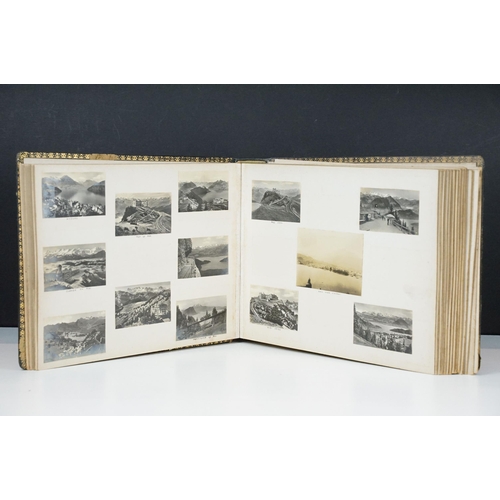 310 - Early 20th century black leather album containing approximately 250 black and white photographs and ... 