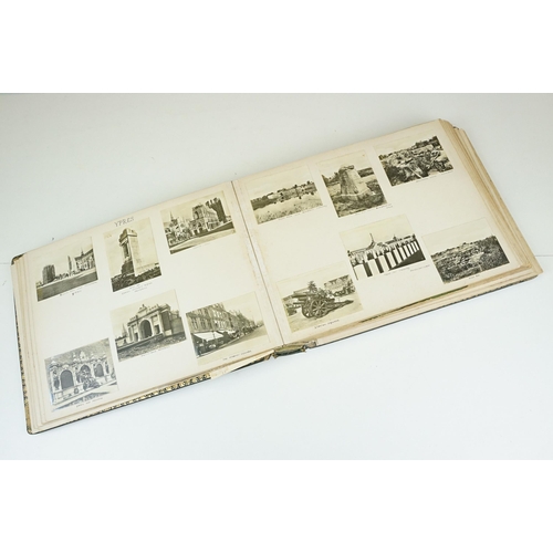 310 - Early 20th century black leather album containing approximately 250 black and white photographs and ... 