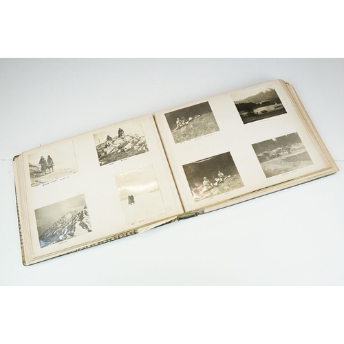 310 - Early 20th century black leather album containing approximately 250 black and white photographs and ... 