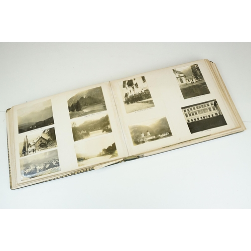 310 - Early 20th century black leather album containing approximately 250 black and white photographs and ... 