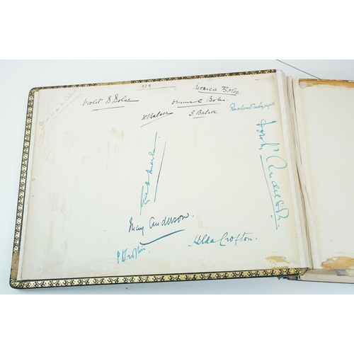 310 - Early 20th century black leather album containing approximately 250 black and white photographs and ... 