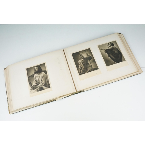 310 - Early 20th century black leather album containing approximately 250 black and white photographs and ... 